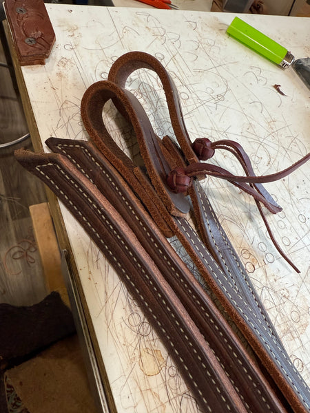 Weighted stitched split reins.